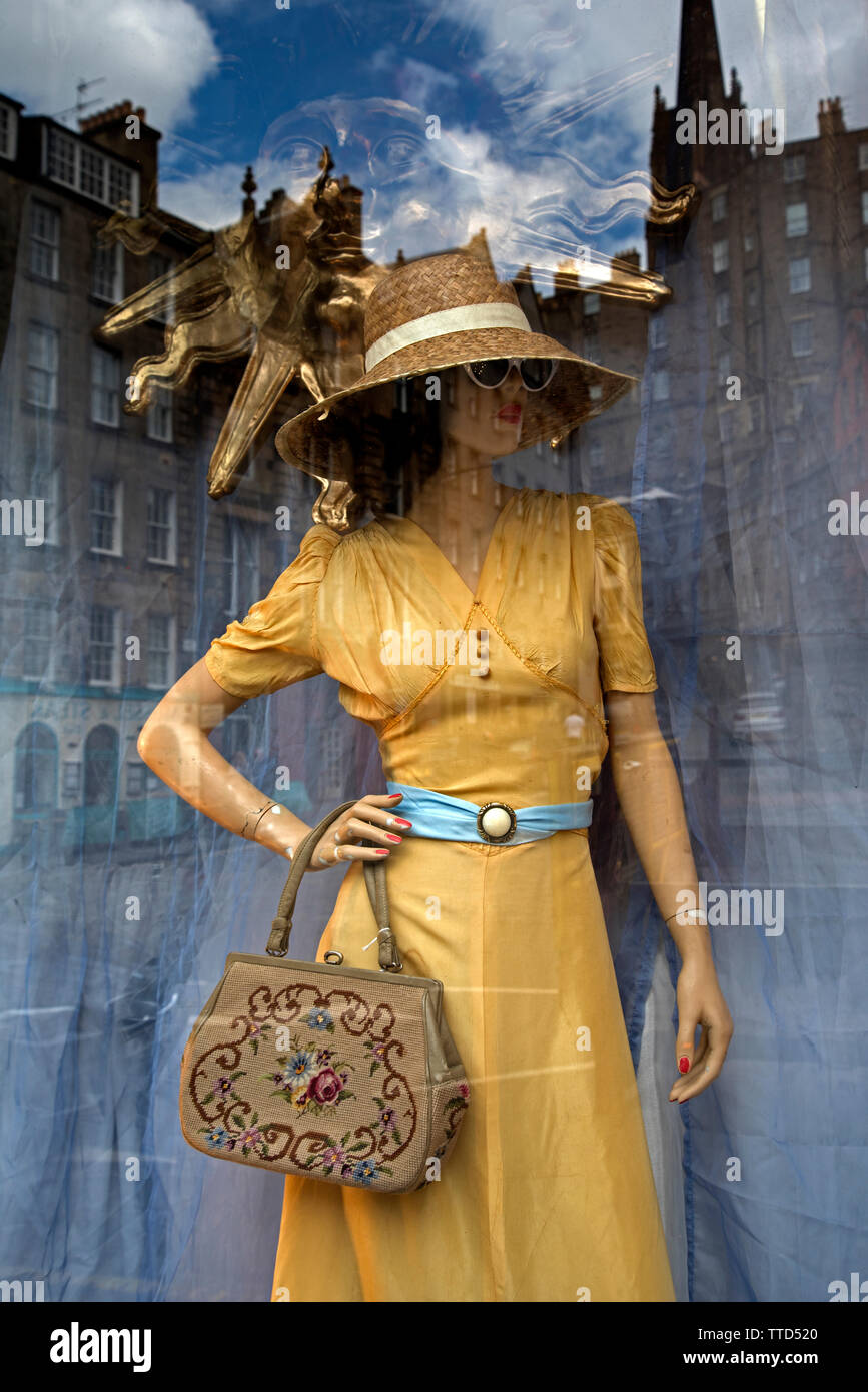 Reflections from the Grassmarket in the window of Armstrong's Vintage Clothing Emporium, Edinburgh, Scotland, UK. Stock Photo