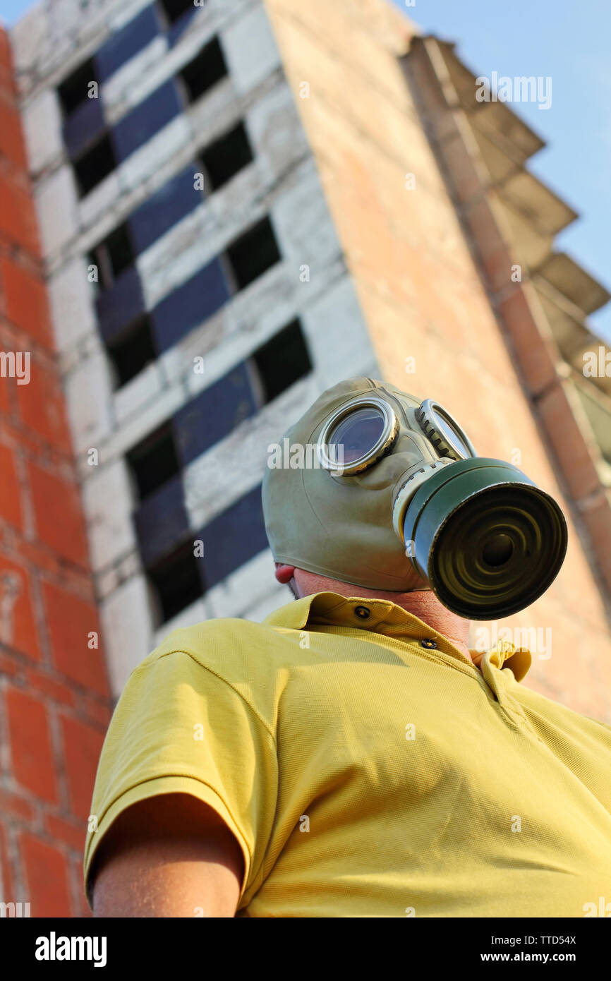 Men in gas mask on destroyed building background taken close up Stock ...