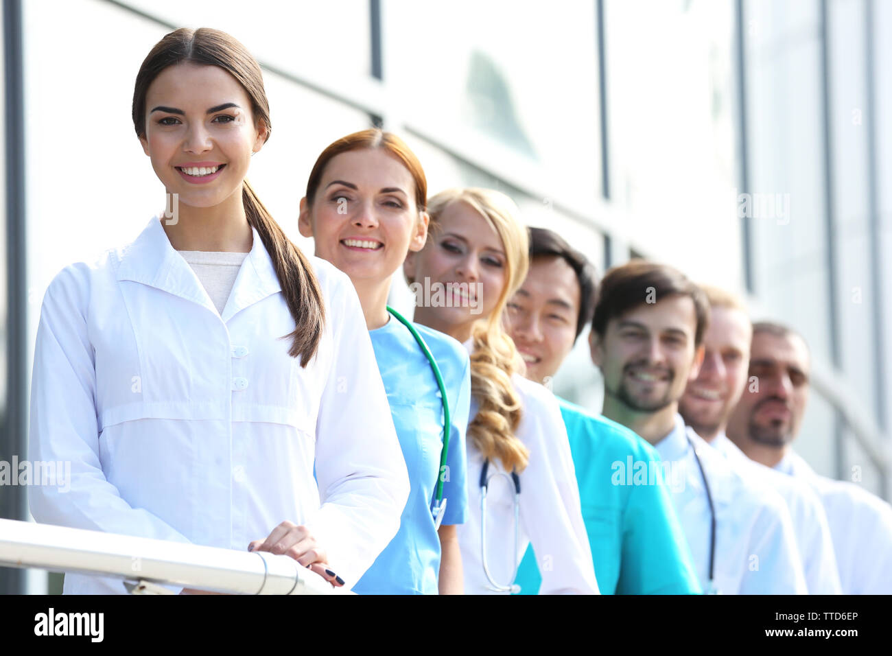 Attractive nurse standing near hi-res stock photography and images - Alamy