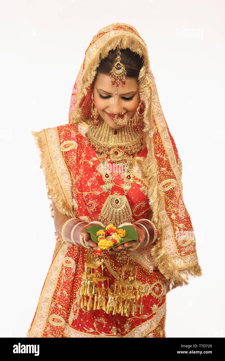 Indian bride performing traditional ritual Stock Photo