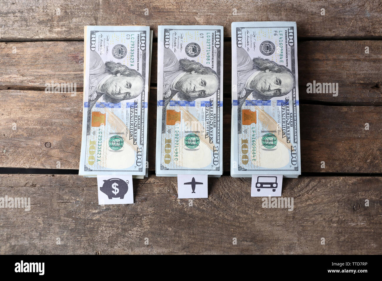 Packs of American dollars, on wooden background. Saving concept Stock Photo Alamy