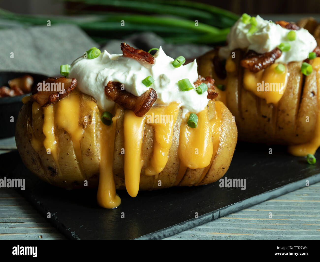 baked potato stuffed with cheese, bacon and sour cream. loaded