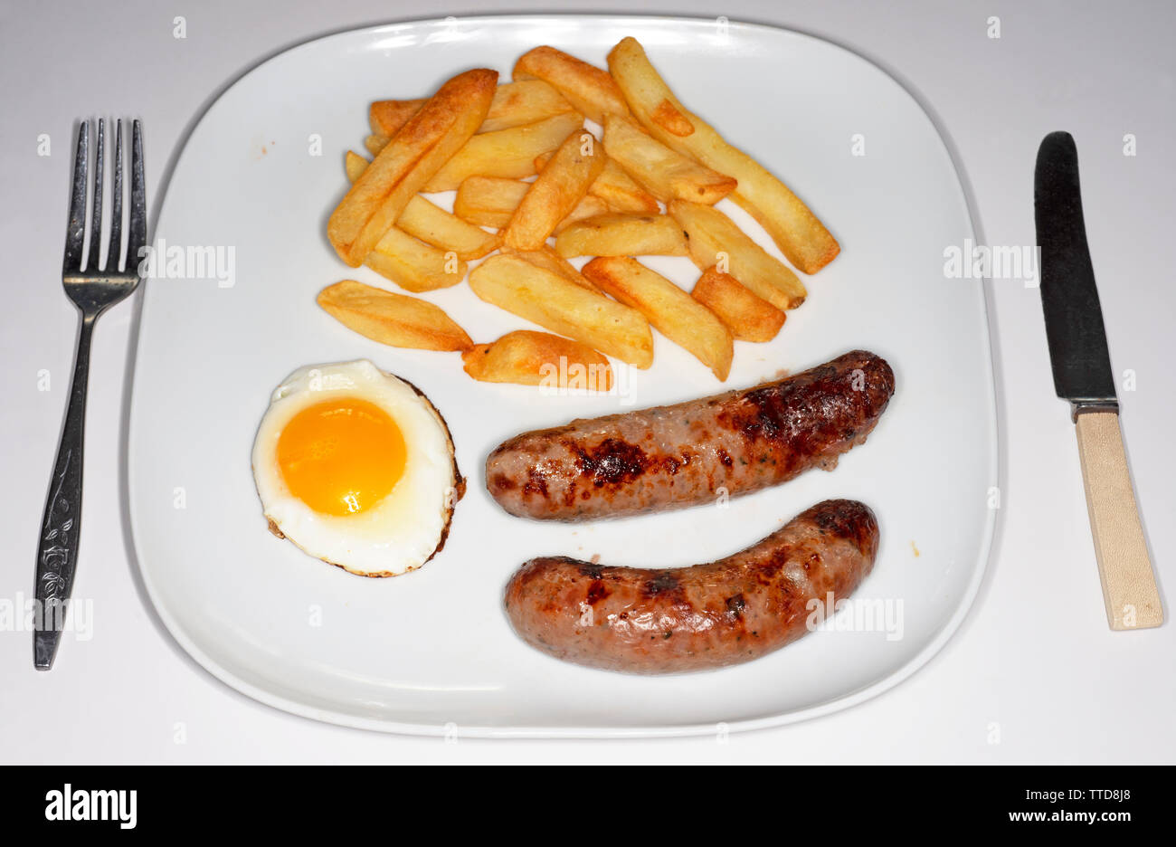 Sausage egg and chips Stock Photo