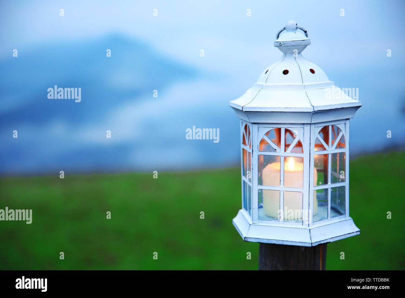 Metal lantern on fence hi-res stock photography and images - Alamy