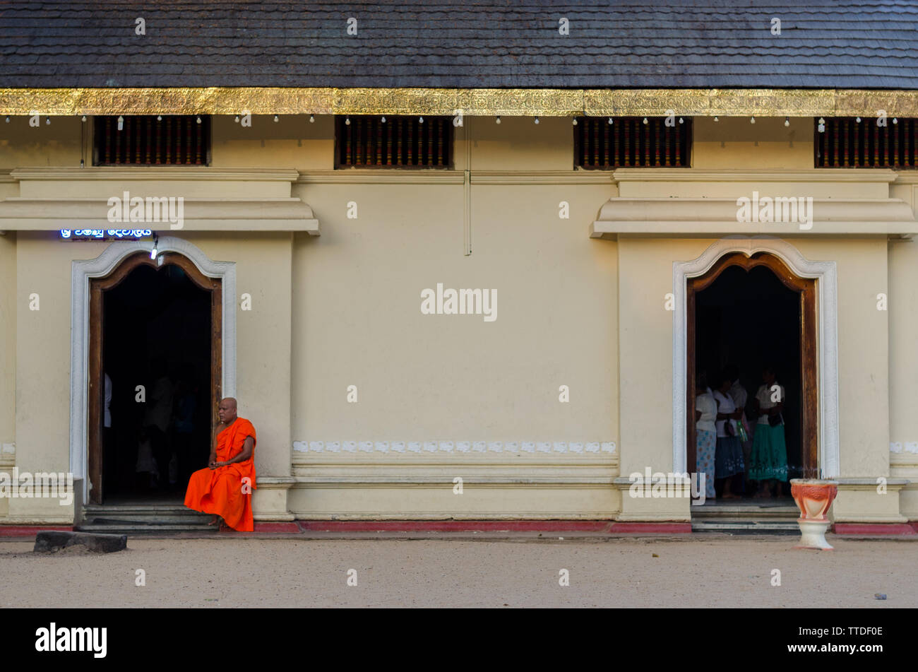 Buddhist monk in temple door hi-res stock photography and images - Alamy