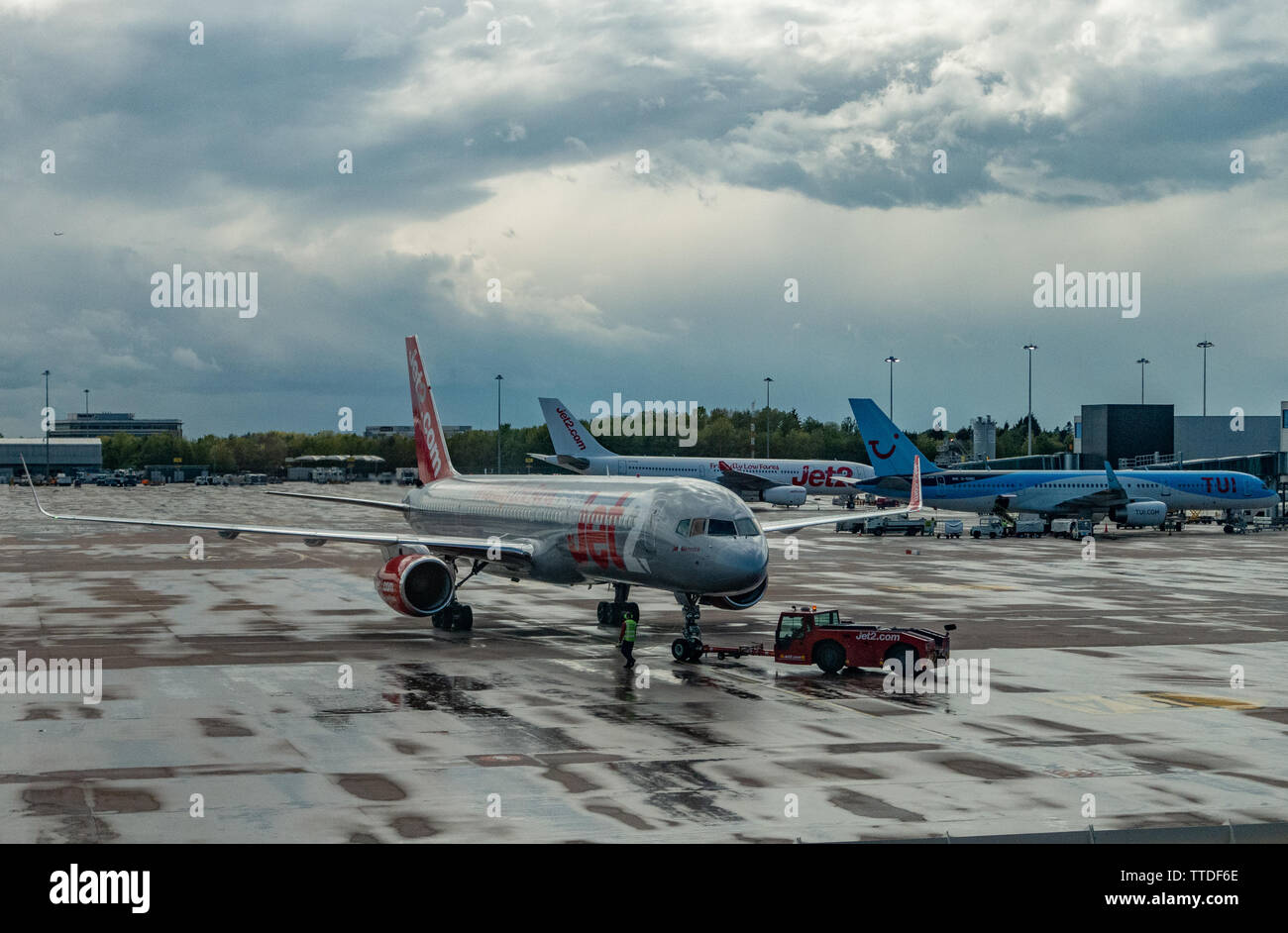A Jet 2 Boeing 737 waits at the landing gate for boarding passengers Stock Photo