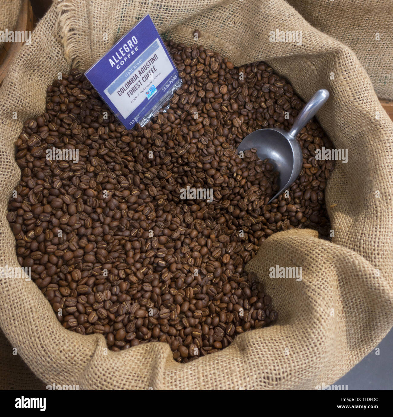Barrels of organic coffee beans for sale at a large food market in New