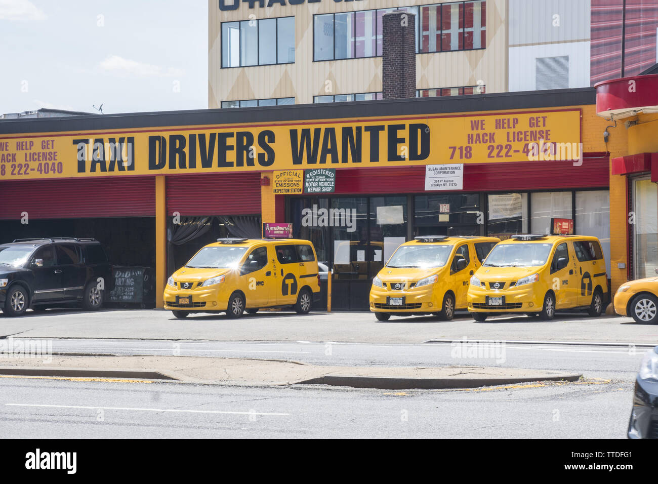 the yellow cqb business is fighting for survival in NYC with the onslaught of the likes of Uber & Lift. Taxi barn on 4th Avenue in Brooklyn, New York. Stock Photo