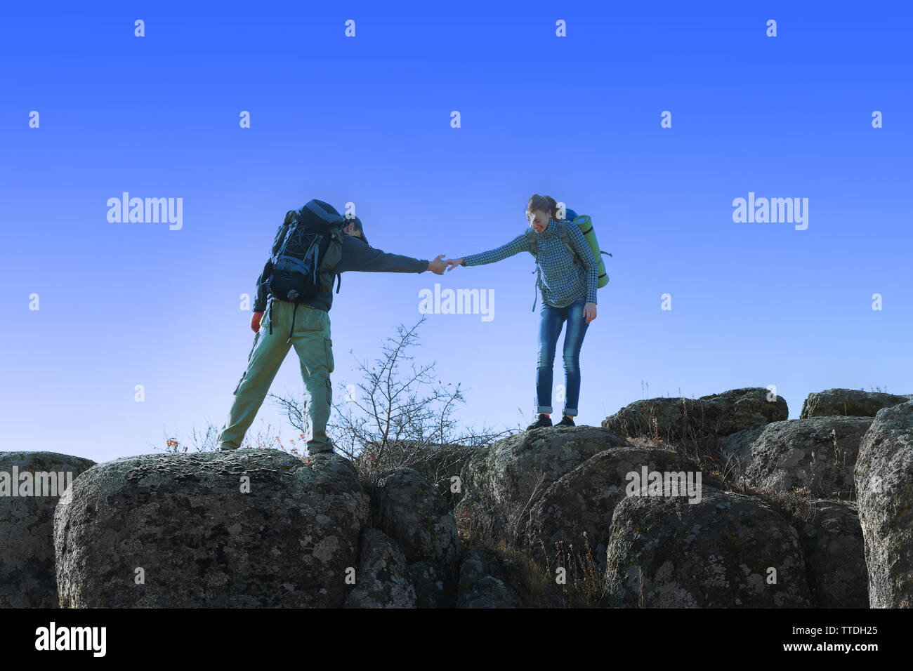 Man and woman on the top of the mountain Stock Photo - Alamy
