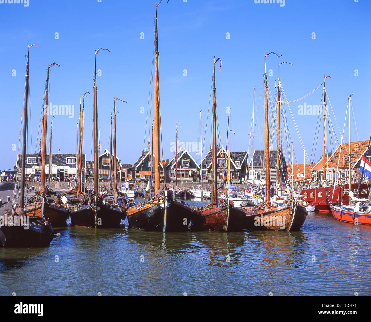 Traditional wooden fishing boats in harbour, Marken, Zaanstreek-Waterland, Noord-Holland, Kingdom of the Netherlands Stock Photo