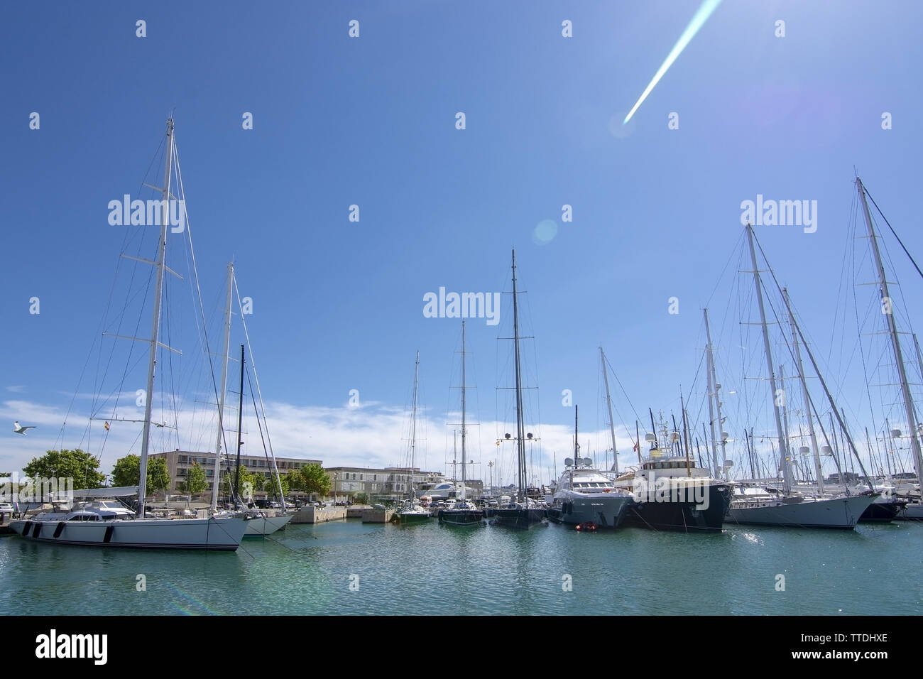 PALMA, MALLORCA, SPAIN - MAY 20, 2019: Old Palma harbor Moll Vell with moored large yachts and vessels on a sunny day on May 20, 2019 in Palma, Mallor Stock Photo
