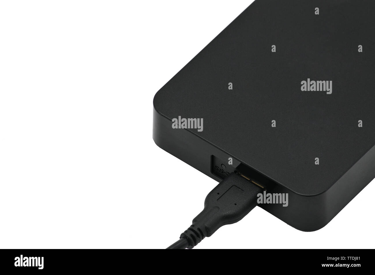 Portable hard drive for backing up various files on an isolated white ...