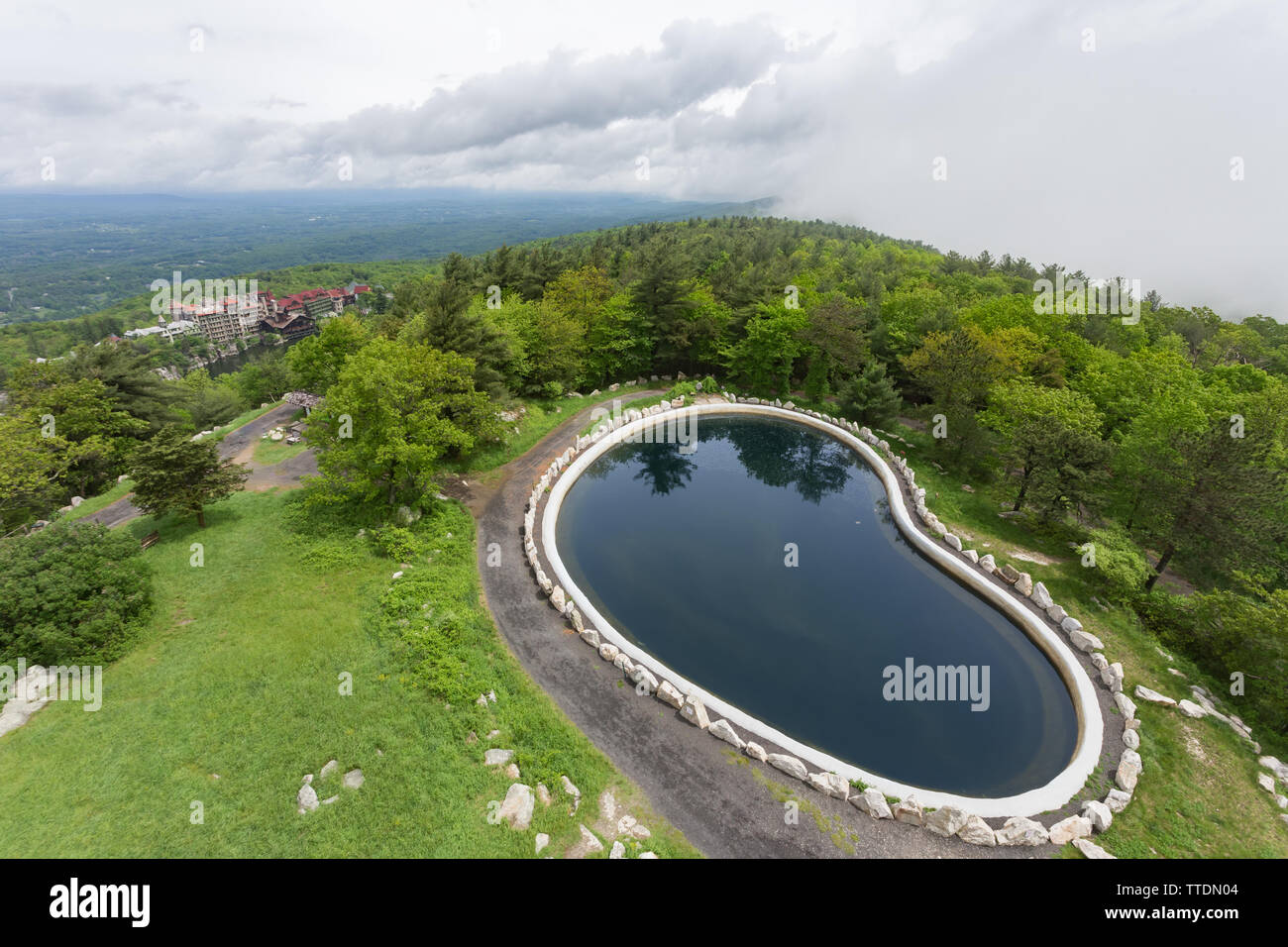 The Skytop reservoir at Mohonk Mountain House in New Paltz, New York minutes after the fog lifted. Stock Photo