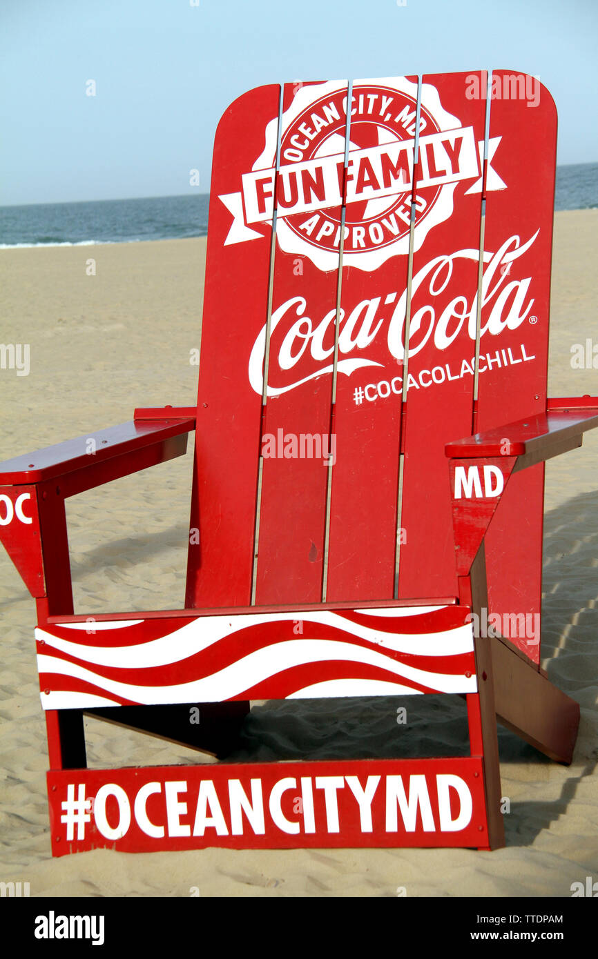 Giant Coca Cola Advertising chair on the beach of Ocean City, MD, USA Stock Photo