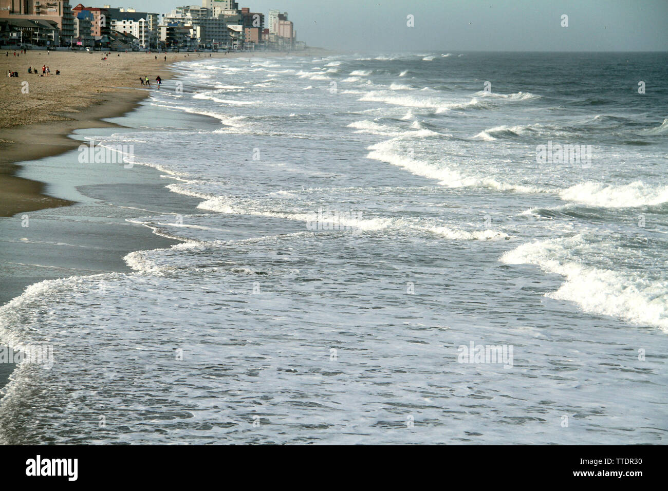 Waves touching the shore on the beach of Ocean City, Maryland, USA Stock Photo