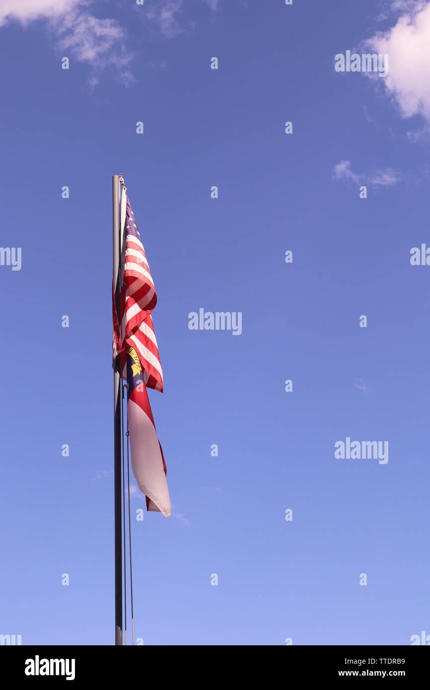 American Flag and North Carolina flag on a flag pole Stock Photo Alamy