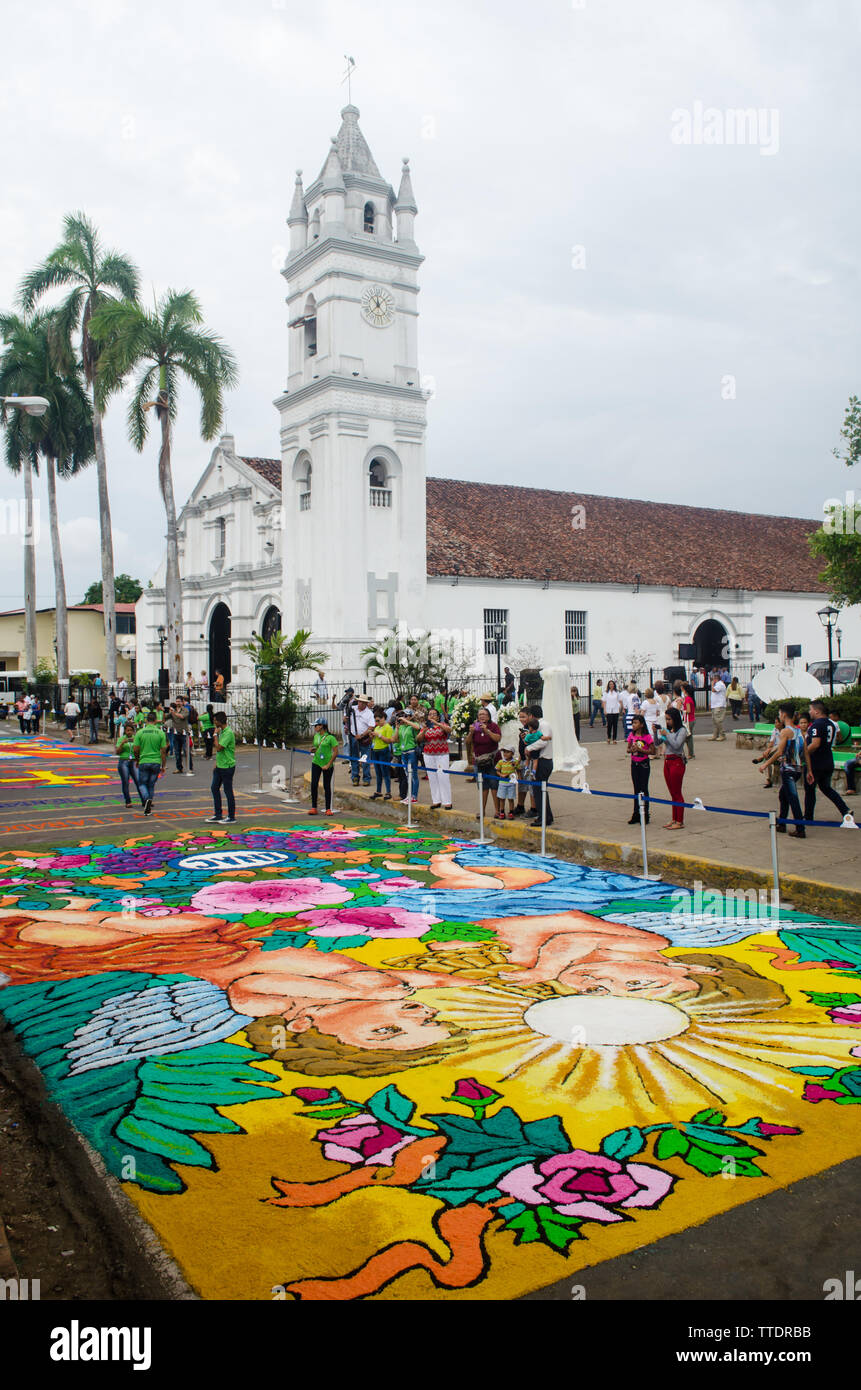 The Church of Saint Athanasius and the colourful carpets, a traditional scene of the Corpus Christi in La Villa de Los Santos Stock Photo