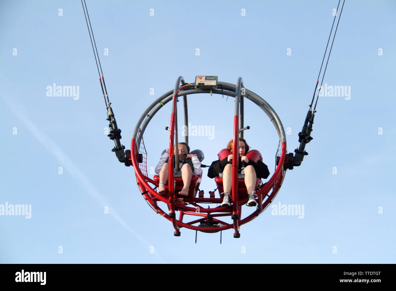 People riding the Slingshot in amusement park Stock Photo - Alamy