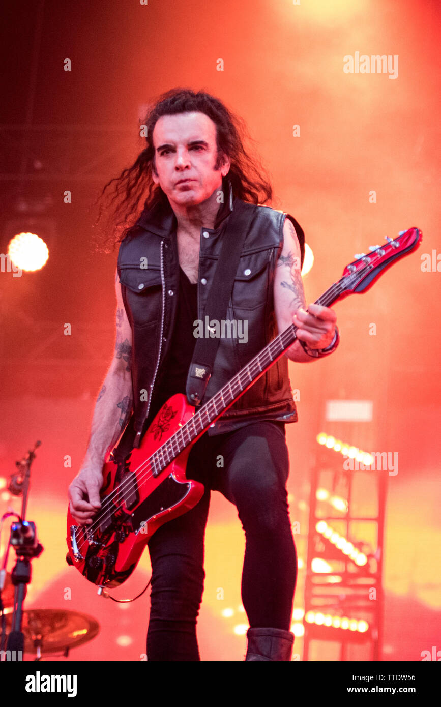 Simon Gallup, bassist of the English postpunk band The Cure, performing live on stage at the