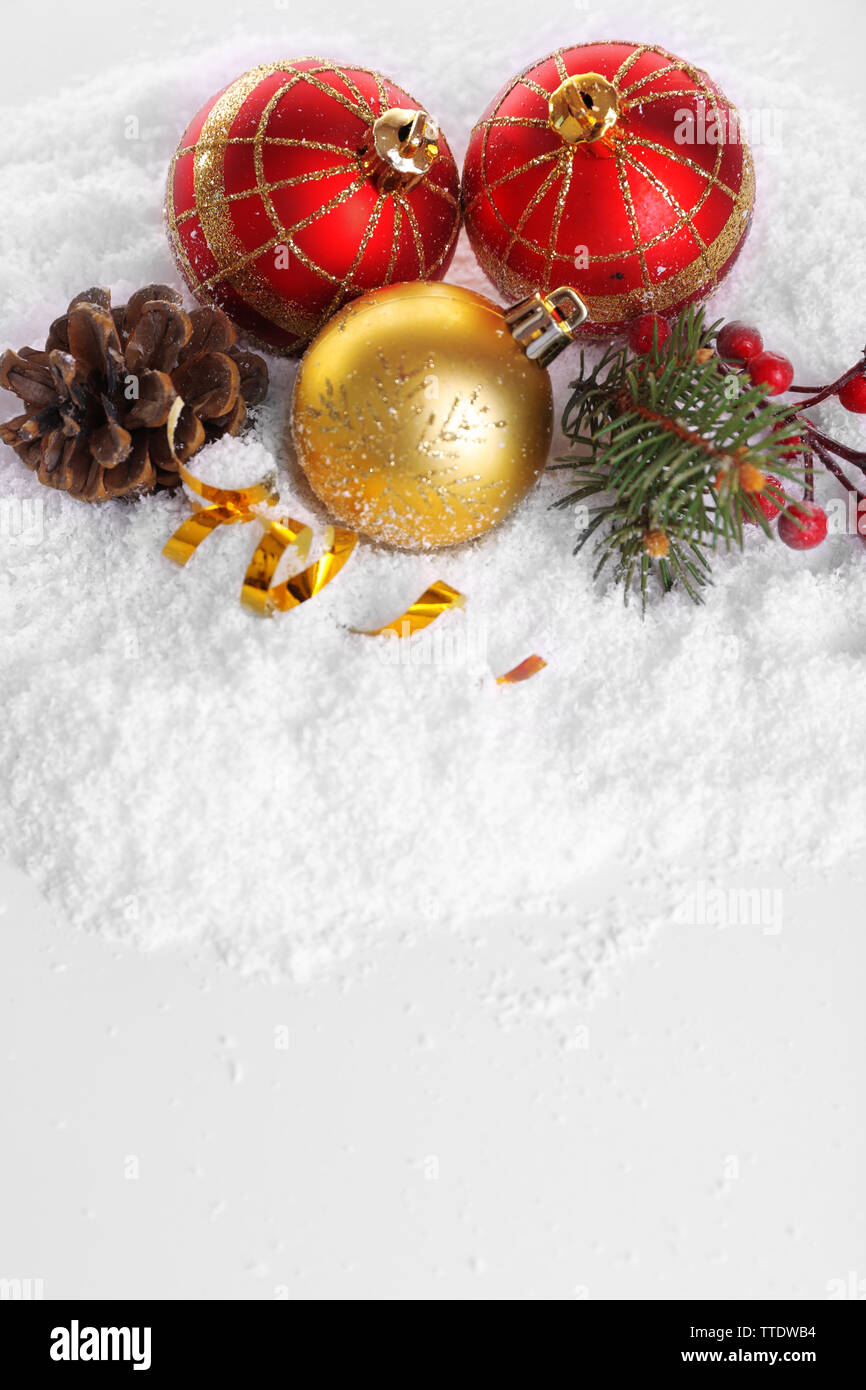 Christmas balls on snow with white background Stock Photo - Alamy