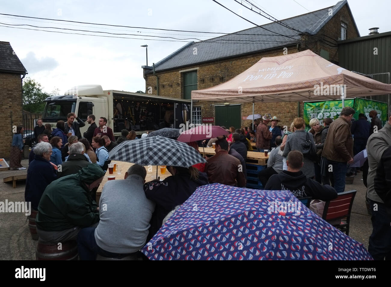 Rain fall at the Mac's Beer & Music Festival 2019. The festival was in the brewery and had live music, and food stalls. Stock Photo