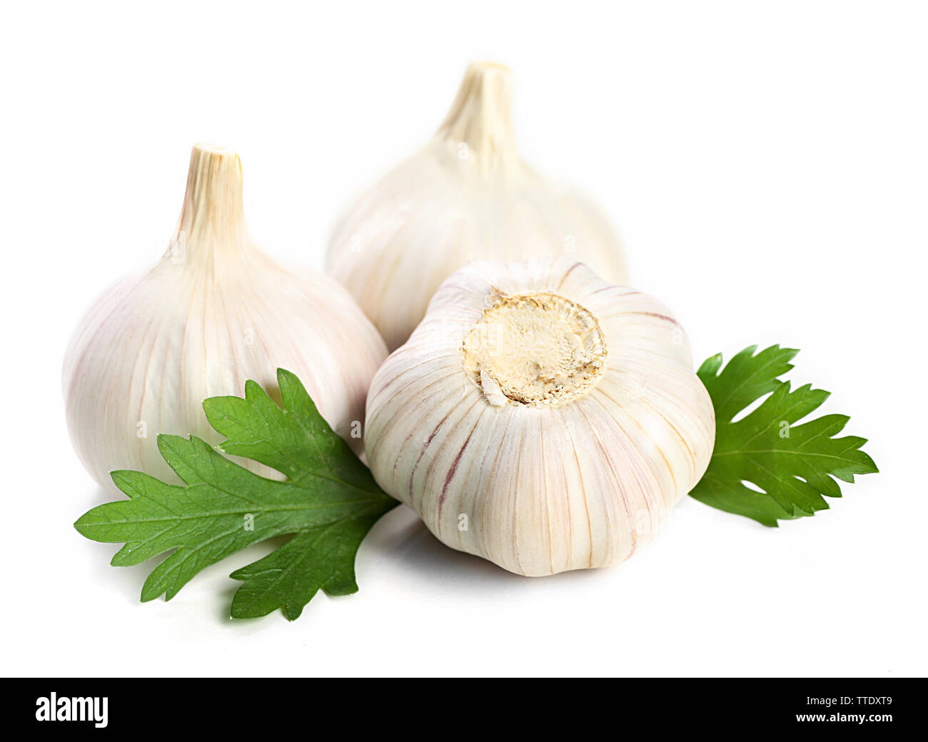 Garlic with leaves of parsley isolated on white Stock Photo - Alamy