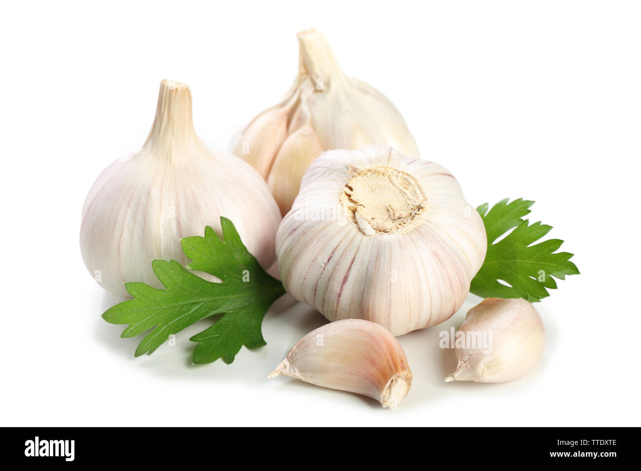 Garlic with leaves of parsley isolated on white Stock Photo - Alamy