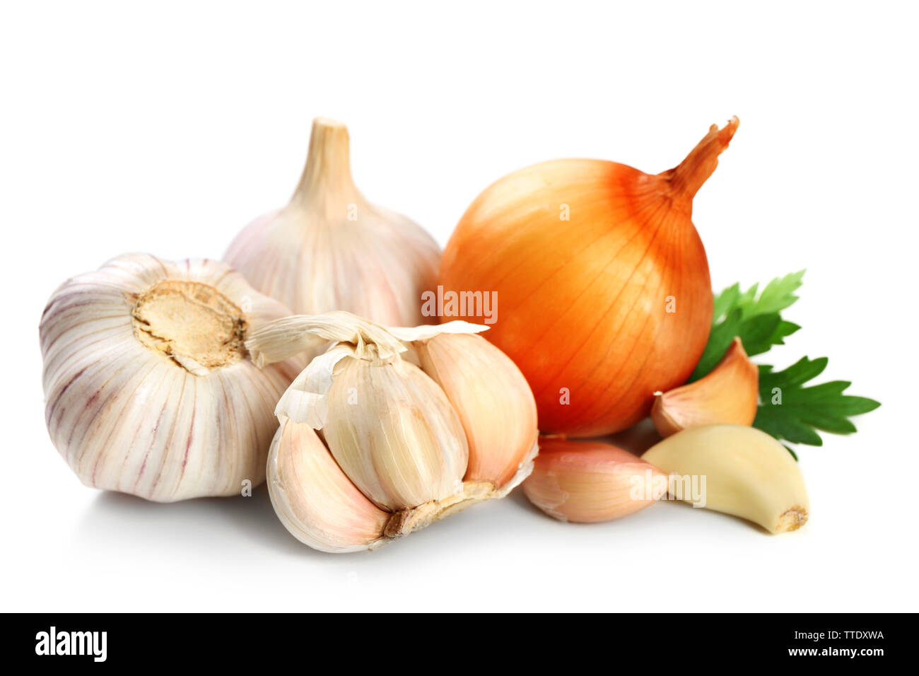 Garlic and onion with parsley leaves isolated on white Stock Photo - Alamy