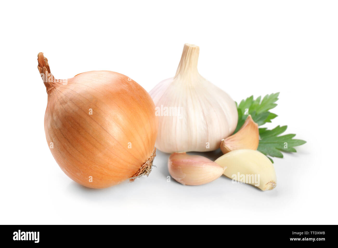 Garlic and onion with parsley leaves isolated on white Stock Photo - Alamy