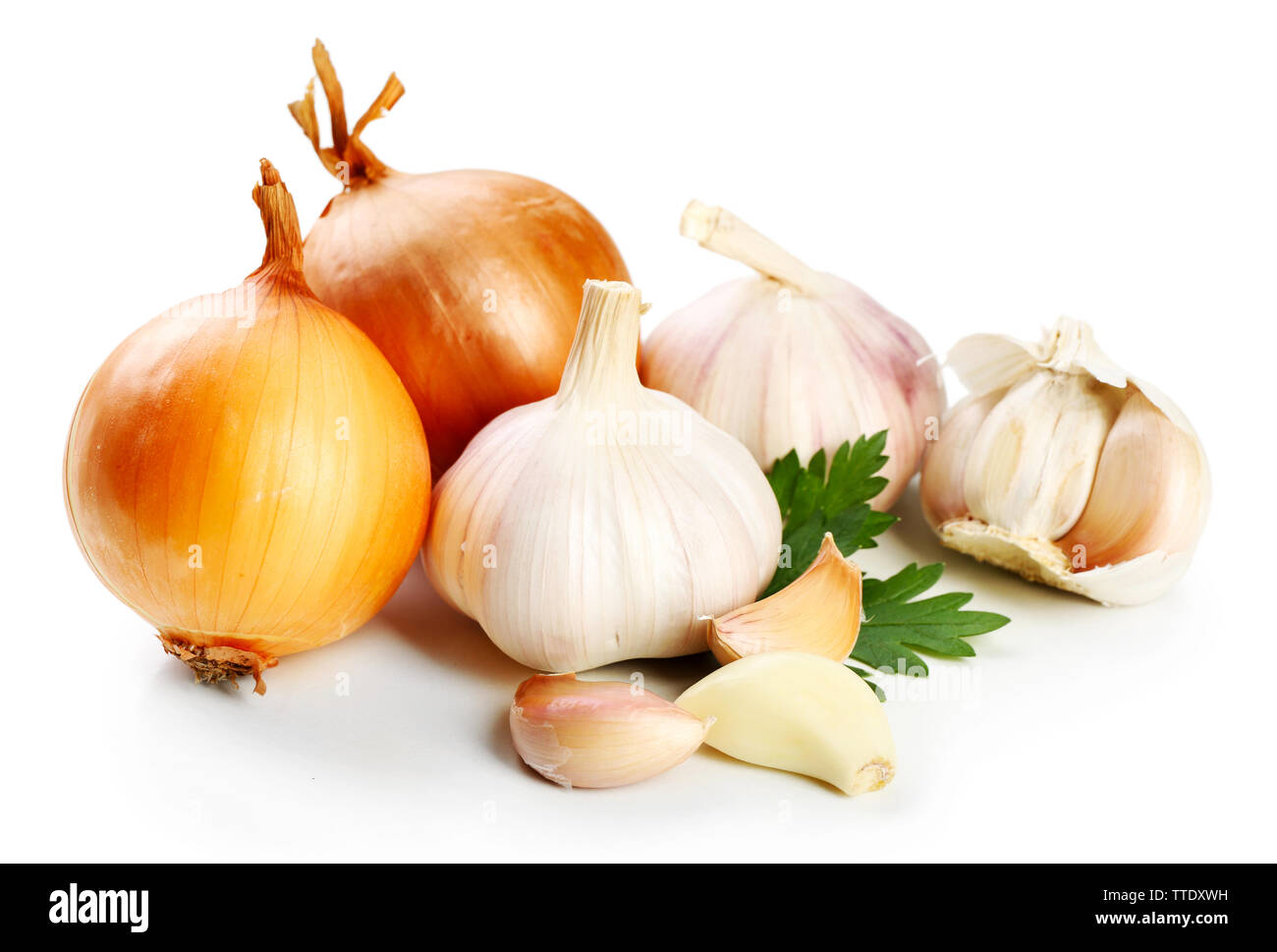 Garlic and onion with parsley leaves isolated on white Stock Photo - Alamy