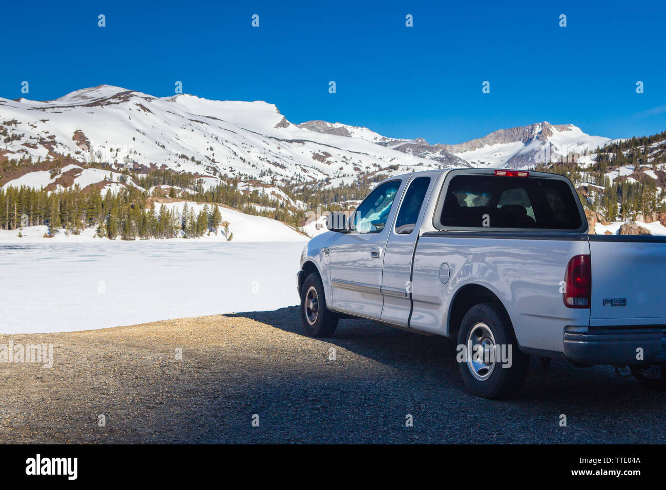 White Ford F150 in the snow covered Sierra Nevada Mountains in California ; USA Stock Photo