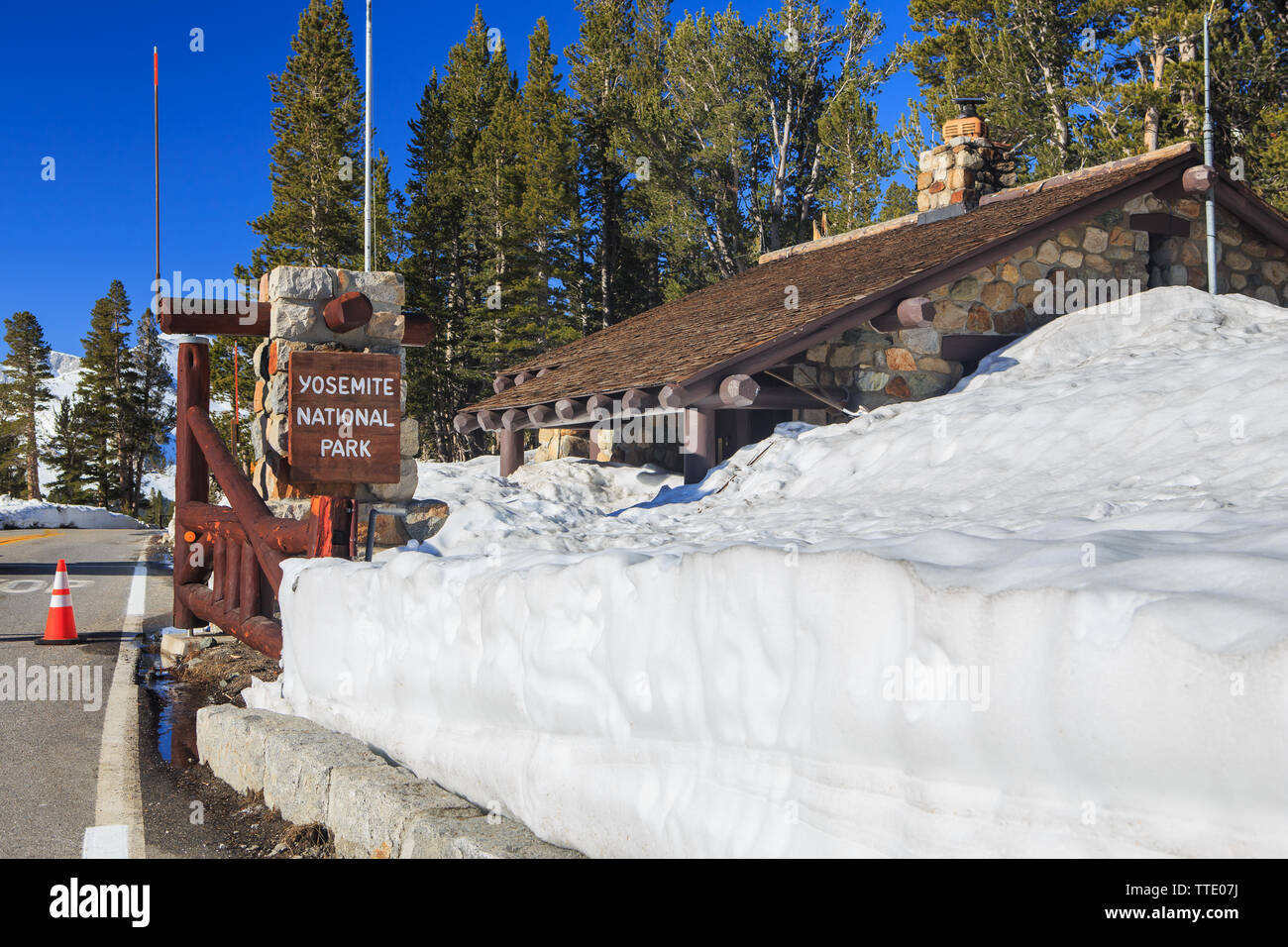 Stone built rangers station cabin covered in snow at the eastern entrance to Yosemite National Park on highway 120 the Tioga Pass. California ; USA Stock Photo