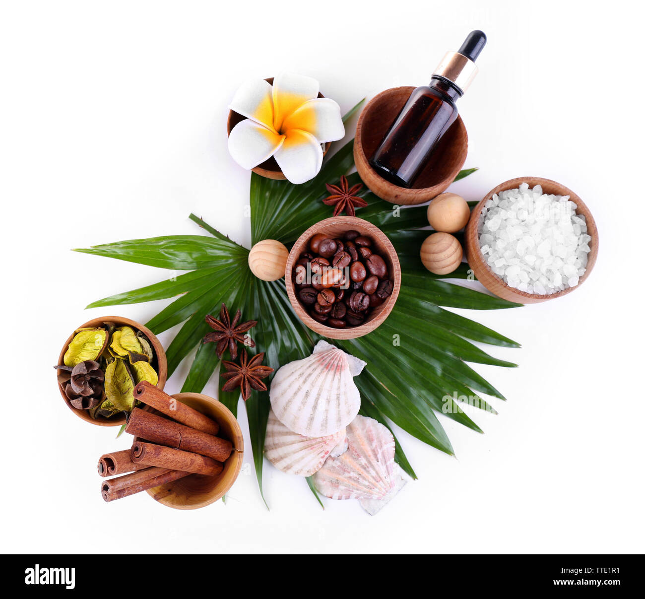 Beautiful spa setting on palm leaf, isolated on white Stock Photo