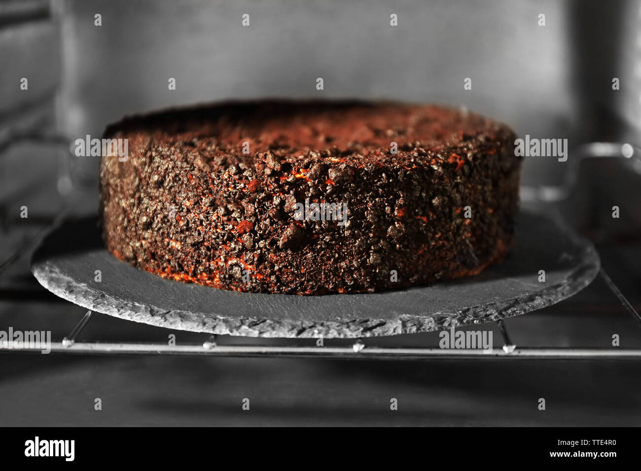 Chocolate cake in oven, close up Stock Photo Alamy