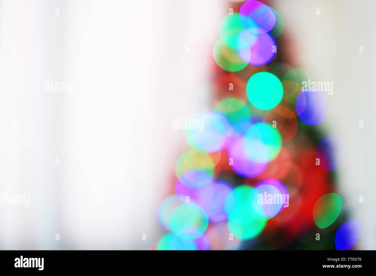 Christmas lights on Christmas tree of abstract background Stock Photo