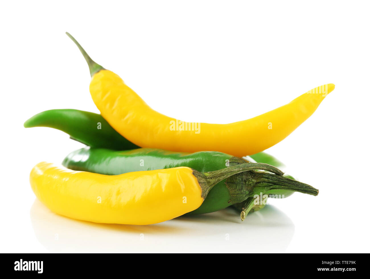 Yellow and green chili peppers isolated on white Stock Photo - Alamy