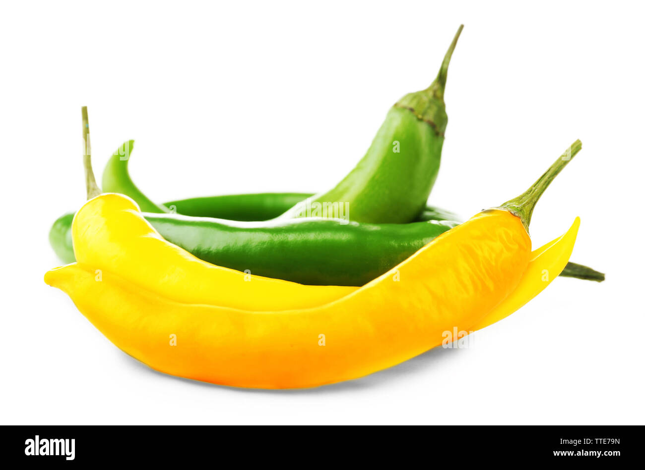 Yellow and green chili peppers isolated on white Stock Photo - Alamy
