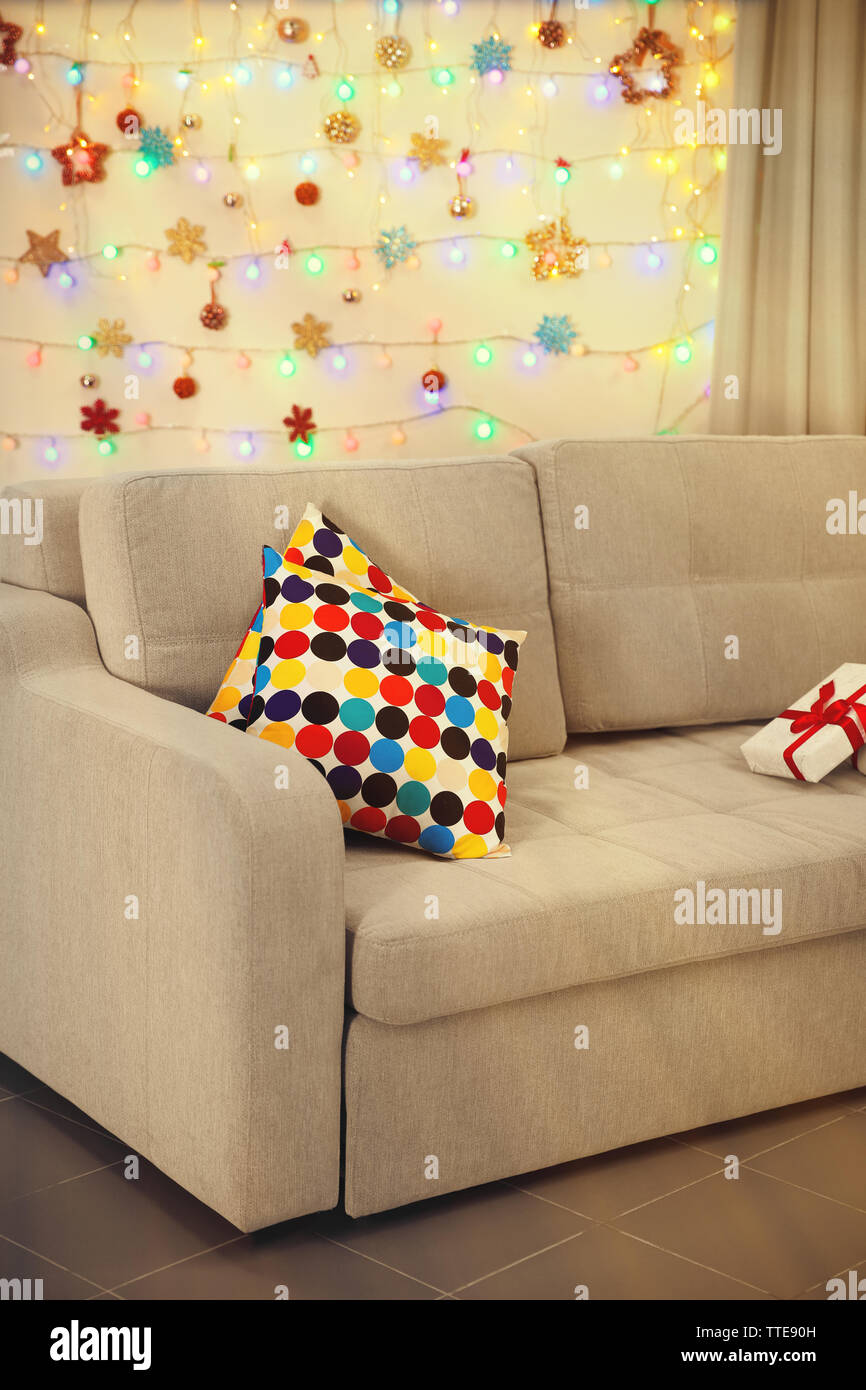 Light Grey Couch With Pillows On Christmas Lights Background Stock Photo Alamy