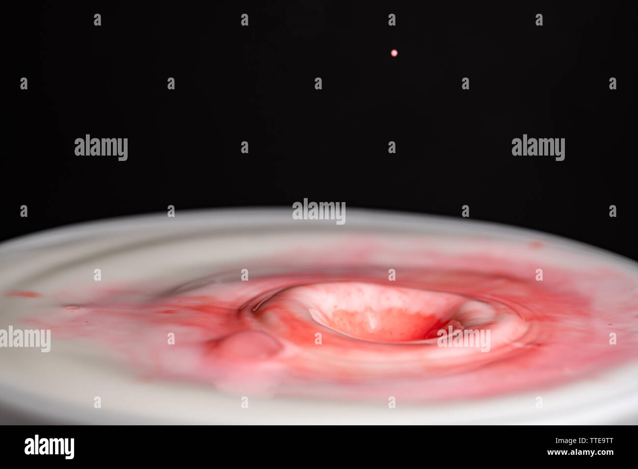 Splash of milk droplets in close up macro high resolution isolated ...