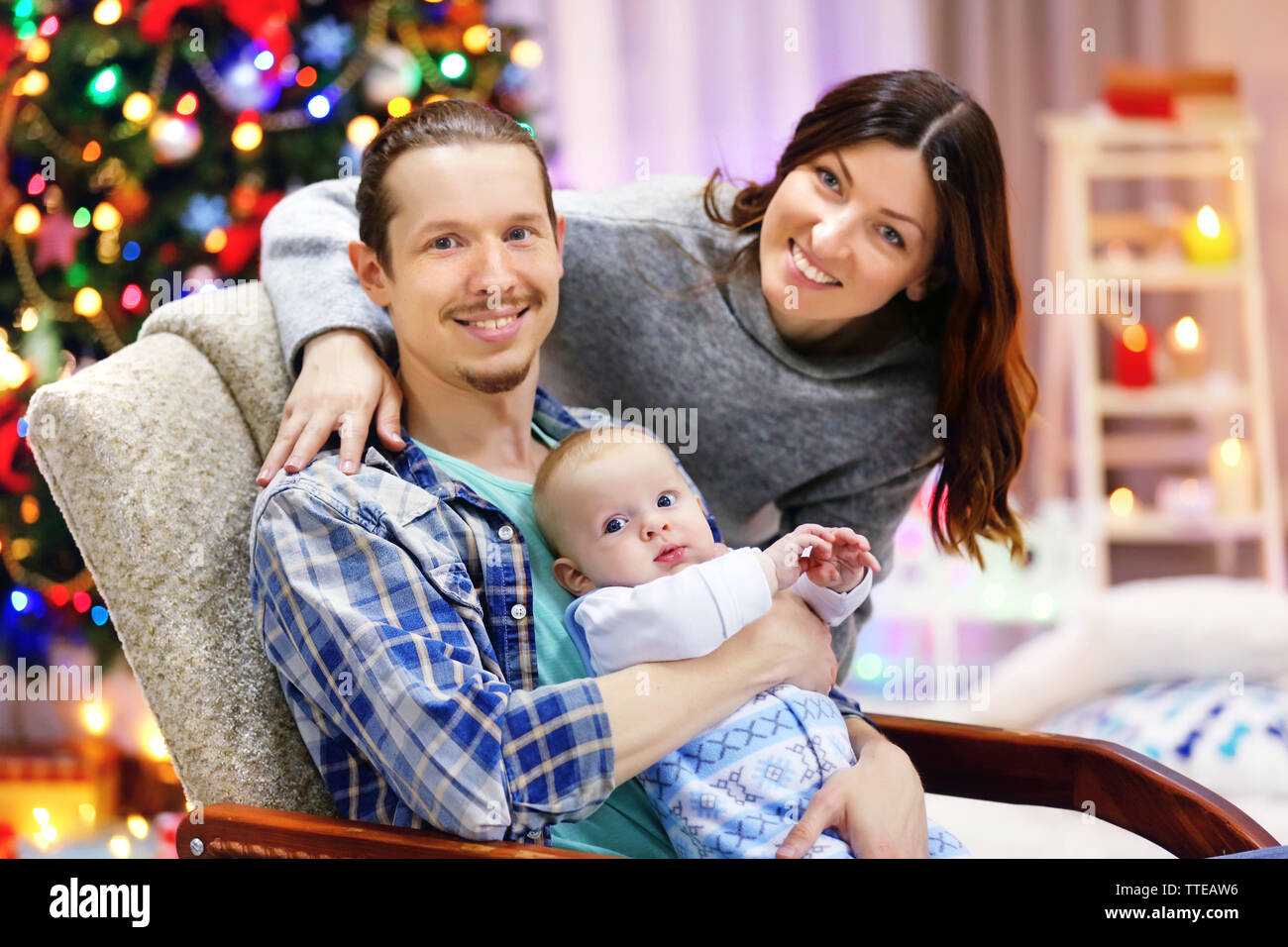 Christmas concept: happy family in decorated room Stock Photo - Alamy