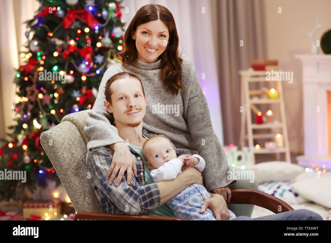 Christmas concept: happy family in decorated room Stock Photo - Alamy