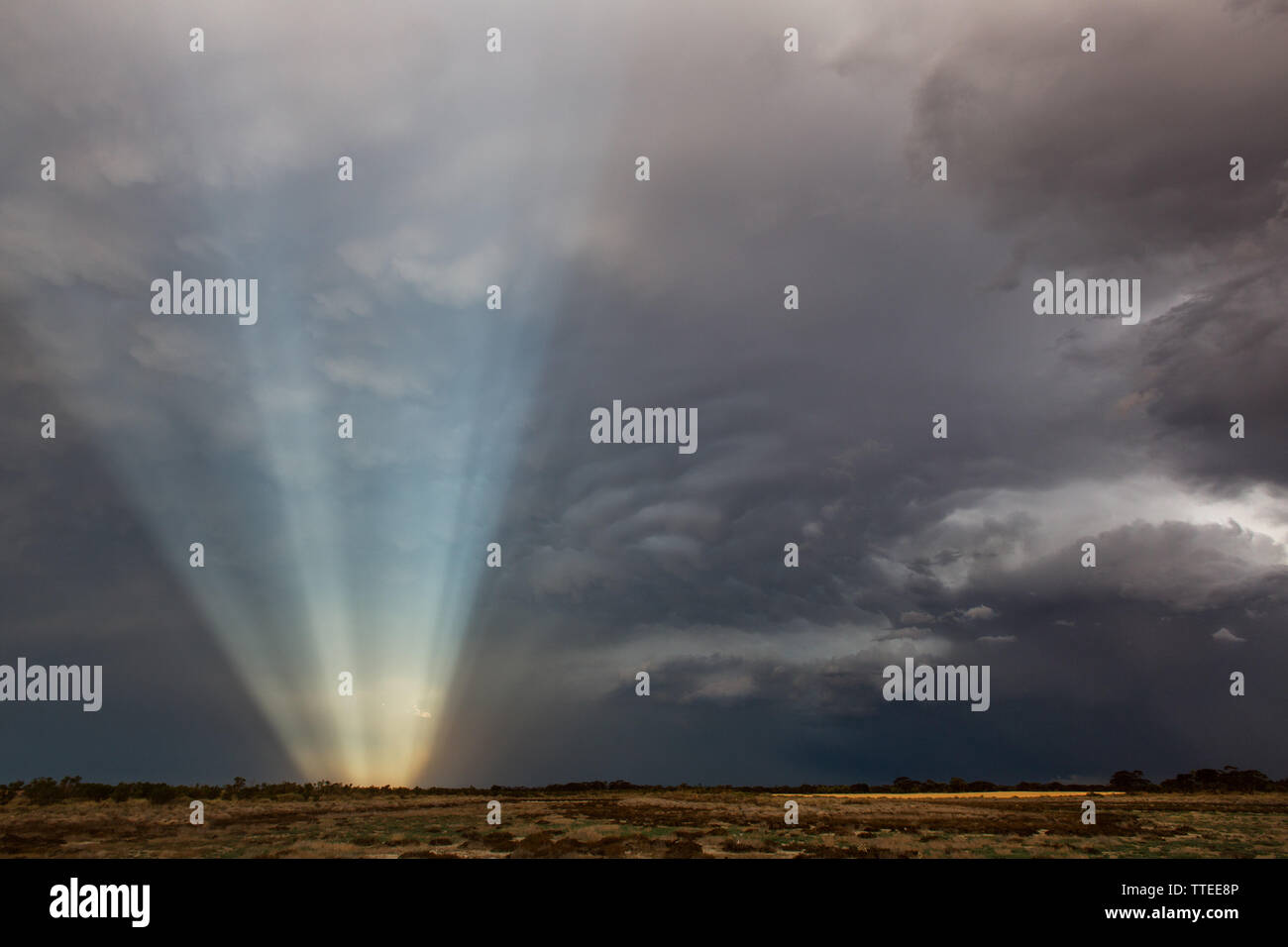 Light rays against a very dark sky Stock Photo