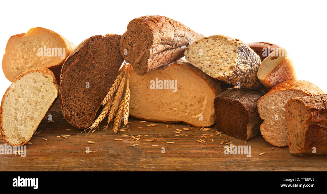 Cut fresh baked bread and wheat ears, isolated on white Stock Photo - Alamy