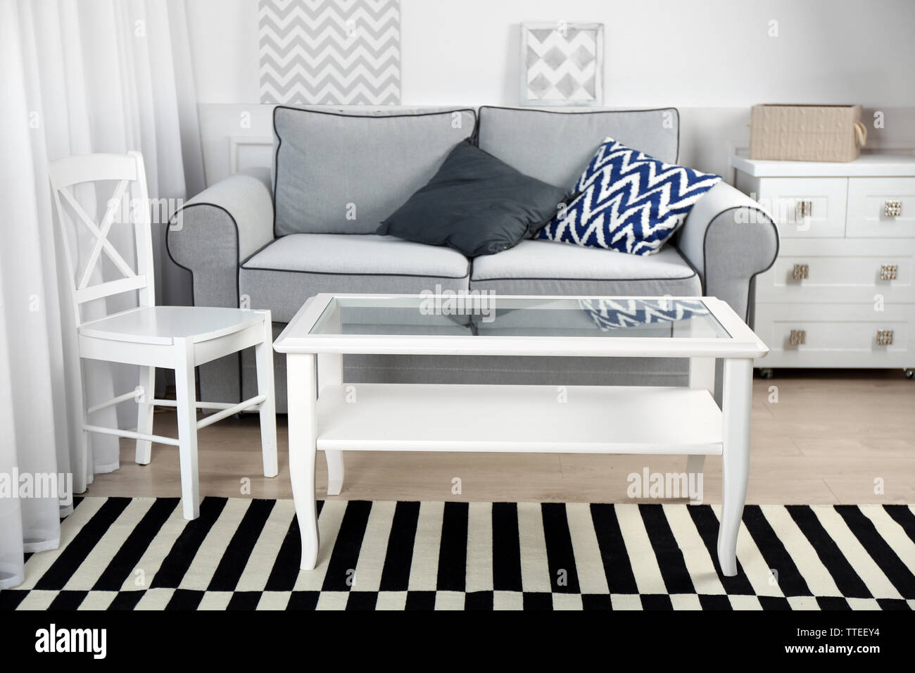 Living room interior with sofa and table Stock Photo - Alamy