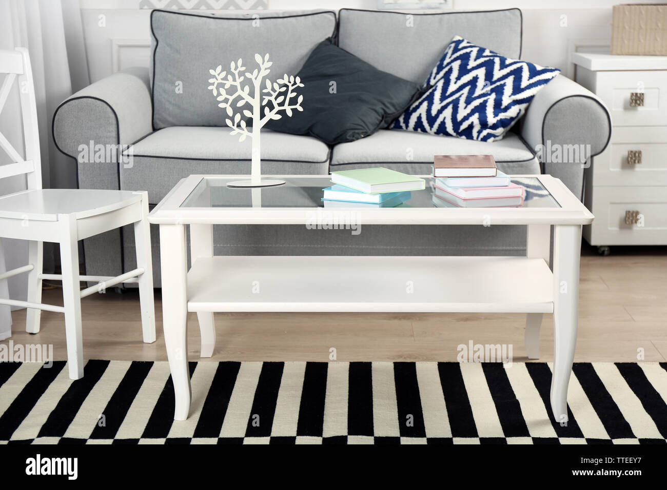 Living room interior with sofa and table Stock Photo - Alamy