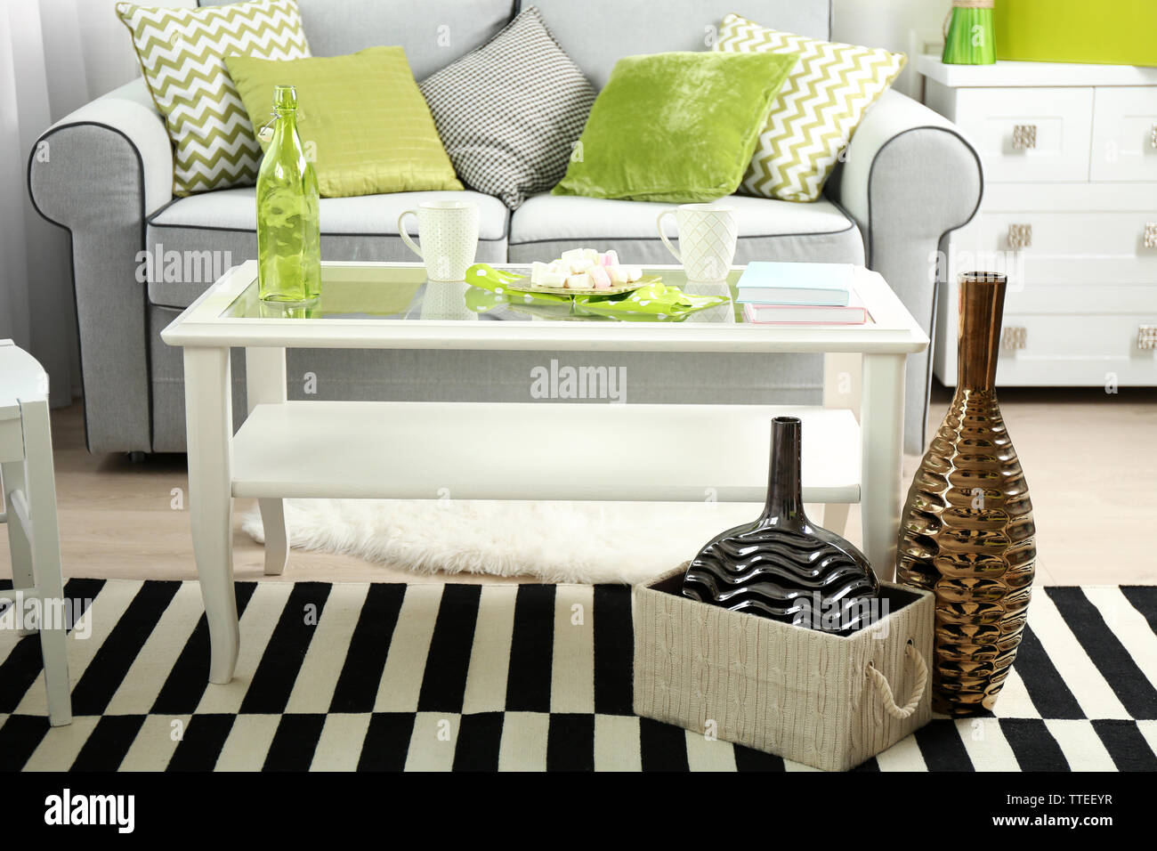 Living room interior with sofa and table Stock Photo - Alamy