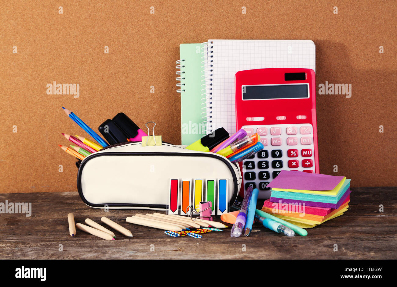 Pencil case with various stationery on old  wooden table Stock Photo