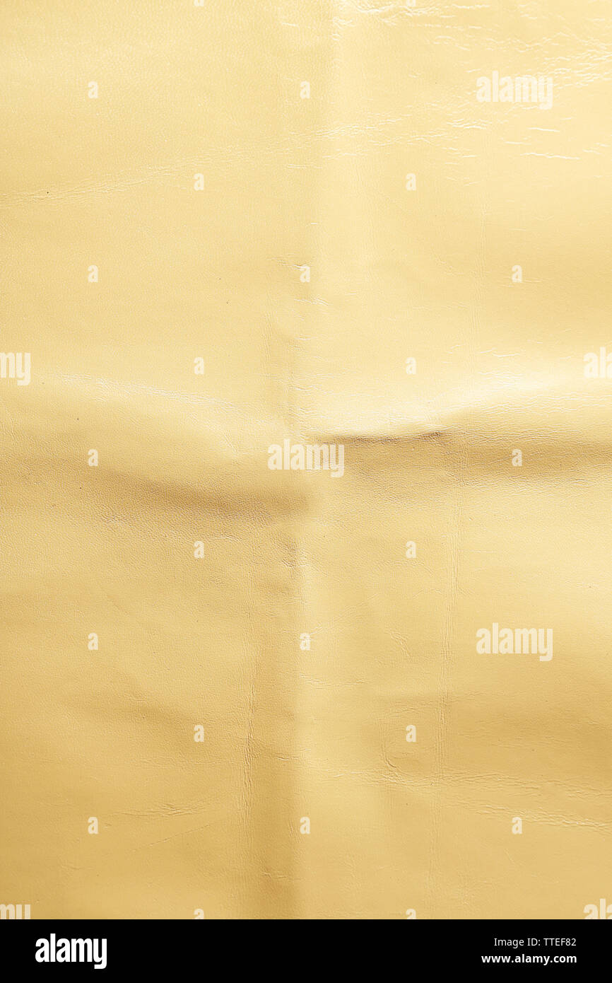 Beige leather texture with crumpled uneven surface Stock Photo