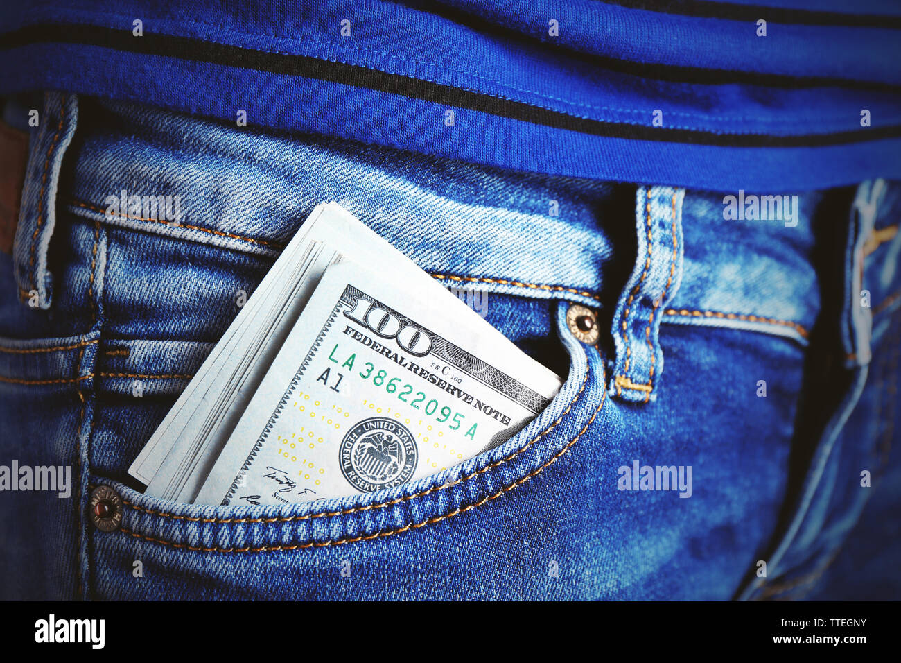 Dollars in jeans pocket closeup Stock Photo Alamy