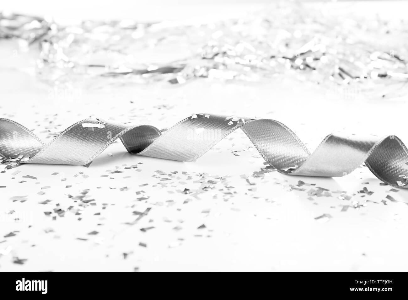 Silver curly ribbon on hi-res stock photography and images - Alamy